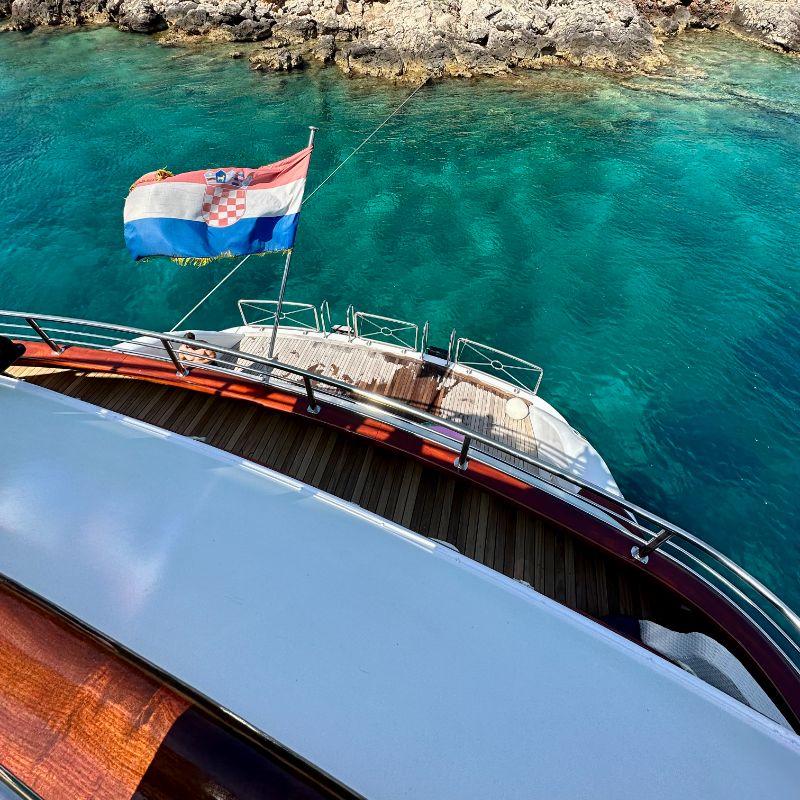 Spacious and stylish yacht deck, ideal for relaxation during a 7-night luxury yacht cruise exploring Croatia's Adriatic Islands and historic cities, with stunning views and comfortable amenities.