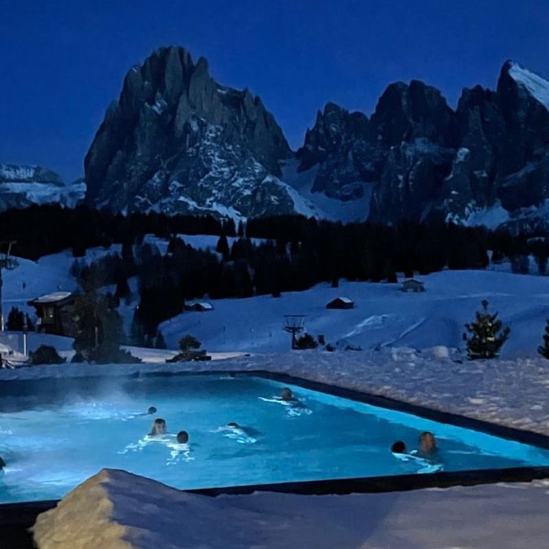 Enjoy a night swim in a heated pool, surrounded by stunning snow-covered views.