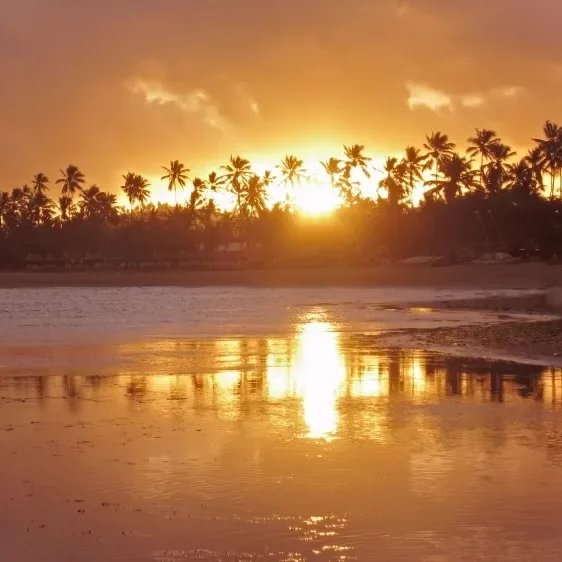 Sunset over the coastline of Northeast Brazil during an exclusive downwind kitesurfing experience, highlighting the stunning scenery and ideal conditions for kitesurfers.