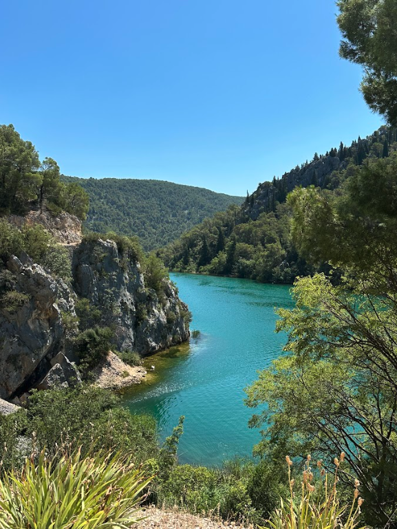 Scenic view of the way to Krka Waterfall in Croatia, captured during a guided cycling tour from Skradin, highlighting the natural splendor and picturesque landscapes of this renowned attraction.